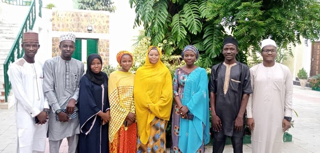 PACE-trained Bridge Connect Africa Initiative team members meet with the Queen of the Kano Emirate Council to present their video on child marriage and discuss the passage of the Kano State Child Protection Bill in Kano, Nigeria.